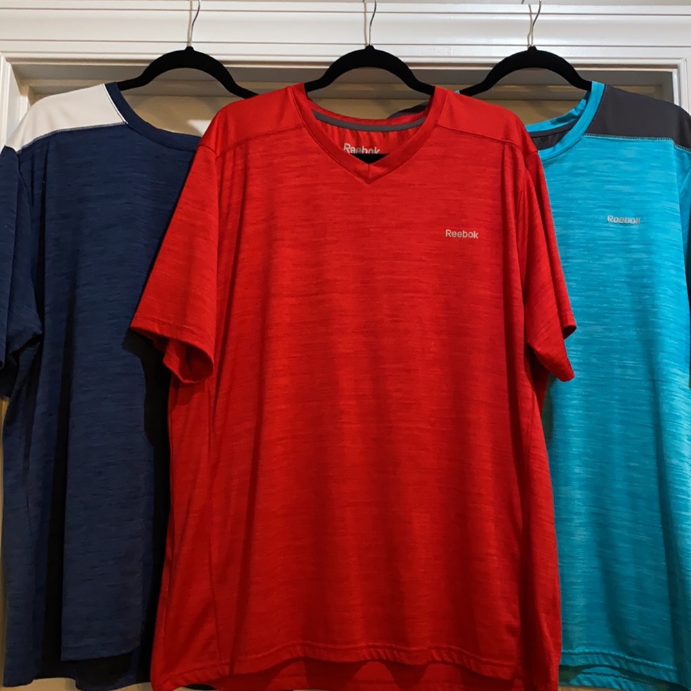 Three men’s Reebok shirts